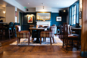 Interior of The Wellington Arms in Hampshire with cozy seating and classic pub décor.